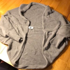 Sweater/wrap. Has 3/4 sleeves.